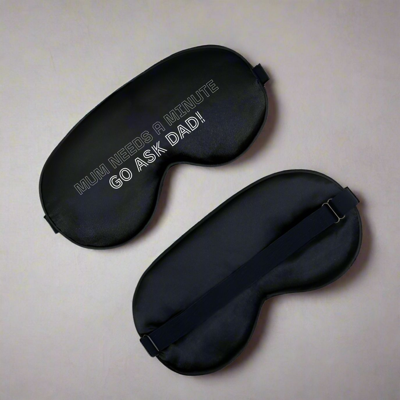 Funny Gift For Mum Travel Eye Mask with text ' Mum needs a minute go ask dad! ' Black mask with other colours available