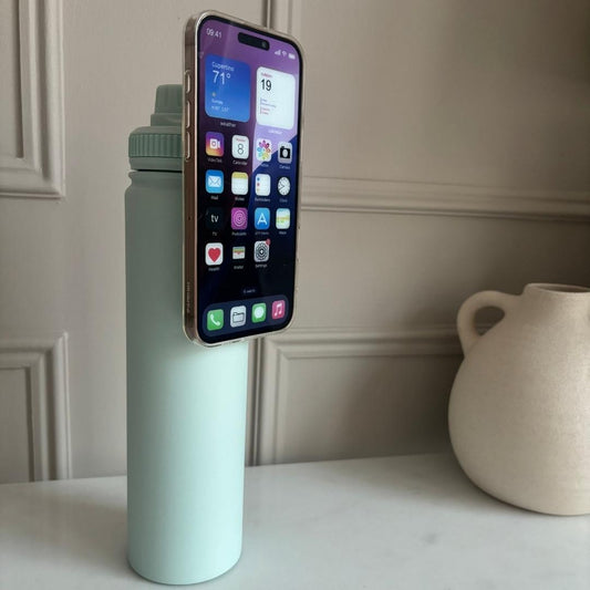 Large 740ml Turquoise Grip Water Bottle with Magnetic Phone Holder UK with phone attached in portrait mode, hands-free, travel hack and daily hydration hack, ready for custom personalisation
