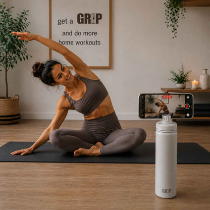 Taupe Phone Holder Water Bottle recording content creation for Pilates Instructor sat on mat in studio. 