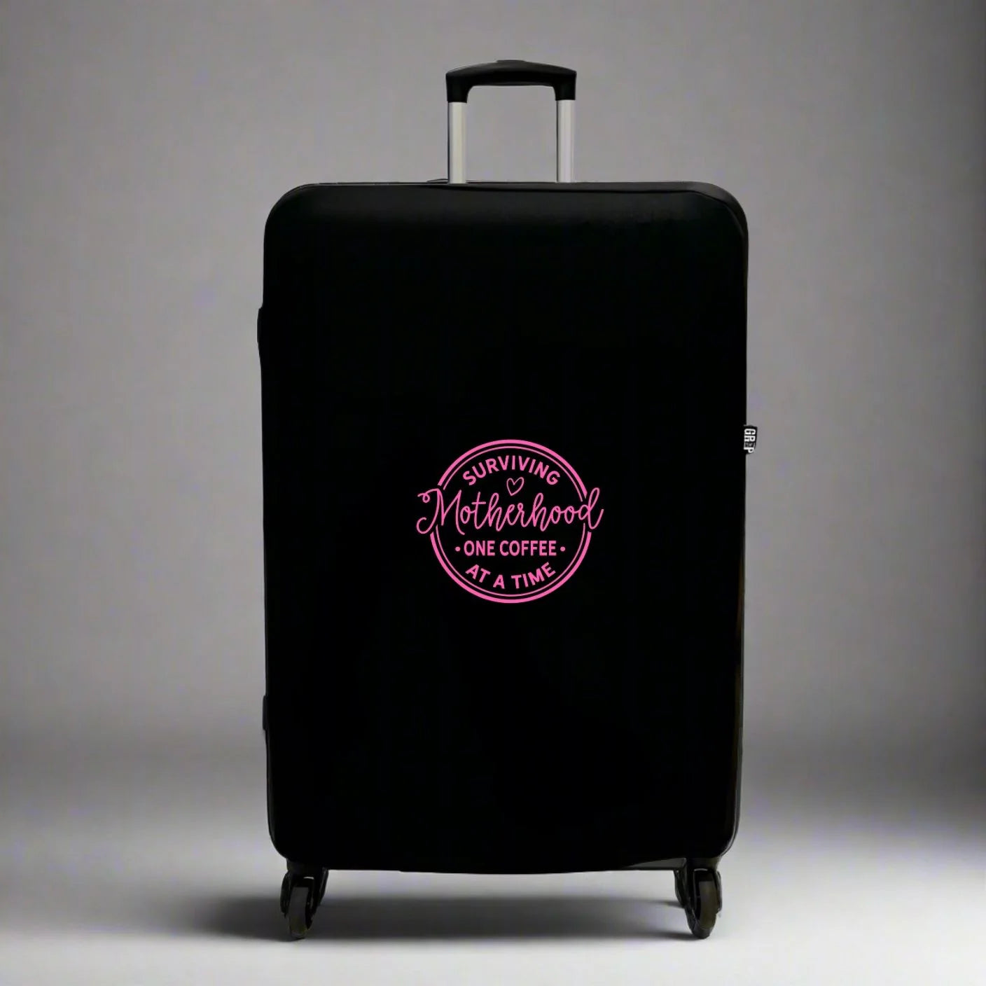 Funny Mothers Day Gift for Coffee Travel Lover Mum UK - Suitcase Luggage Protector in Black with Sage Green text Surviving Motherhood One Coffee at a Time in bright pink