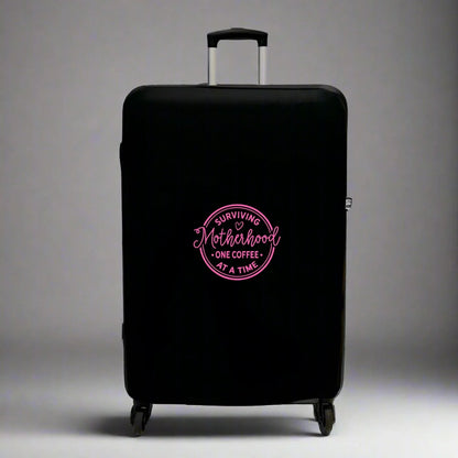 Funny Mothers Day Gift for Coffee Travel Lover Mum UK - Suitcase Luggage Protector in Black with Sage Green text Surviving Motherhood One Coffee at a Time in bright pink