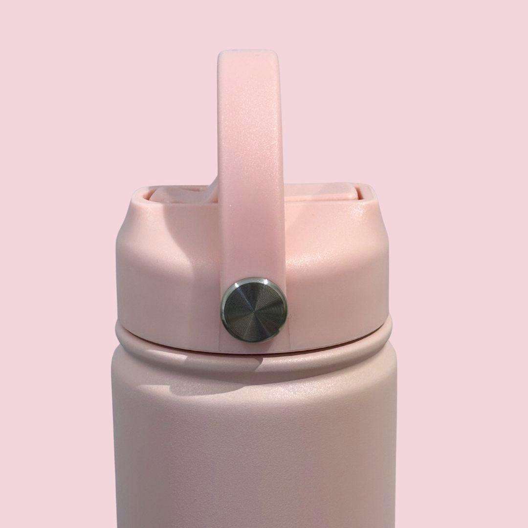 Kids water bottle easy-sip straw lid with handle on baby pink Grip bottle side view