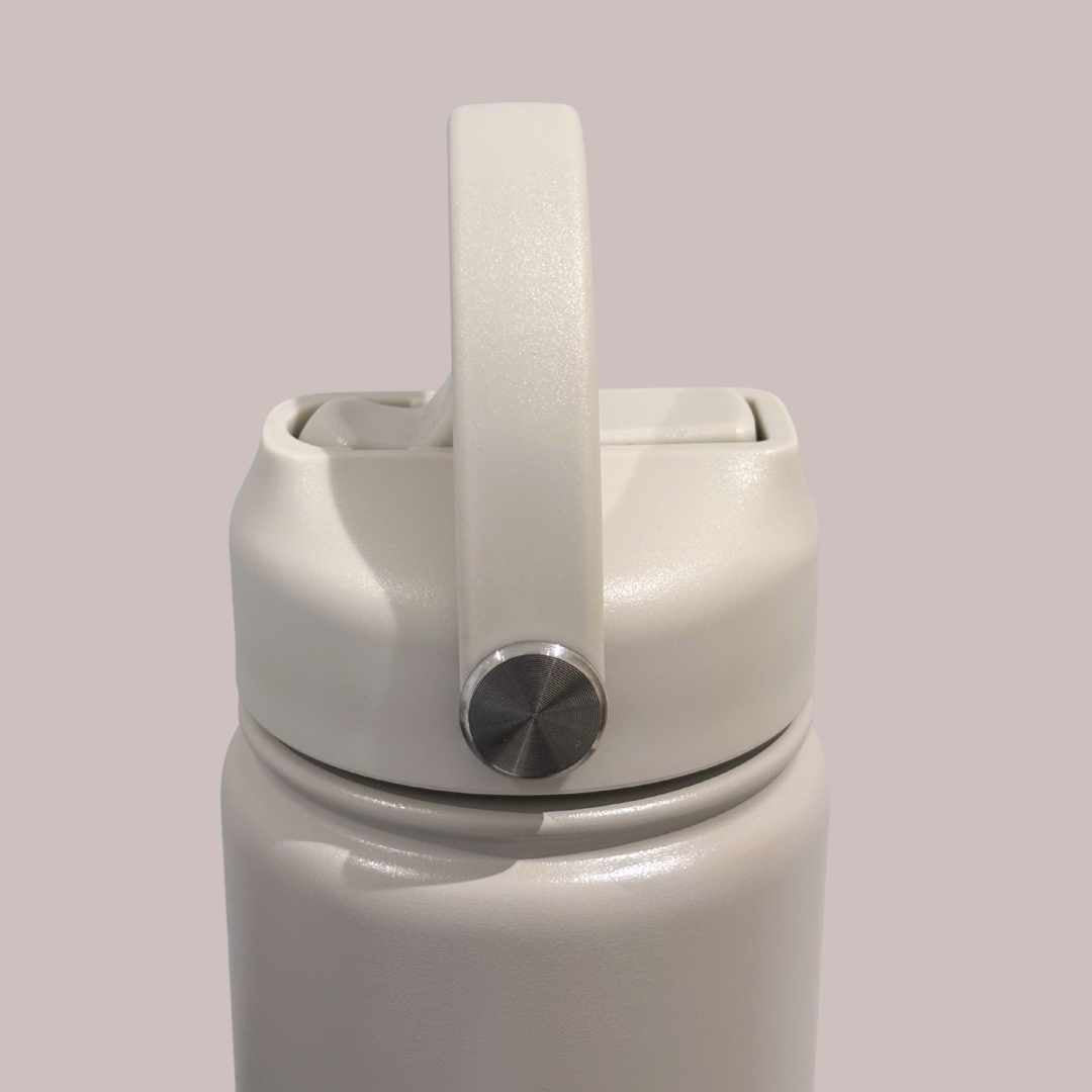 Kids water bottle easy-sip straw lid with handle on taupe beige Grip bottle side view