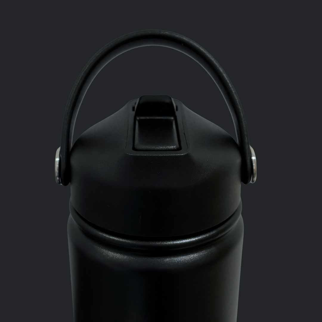 Kids water bottle easy-sip straw lid with handle up on black Grip bottle 