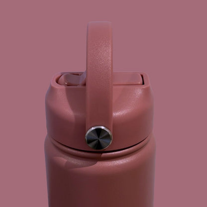 Kids water bottle easy-sip straw lid with handle on dusky rose pink Grip bottle side view