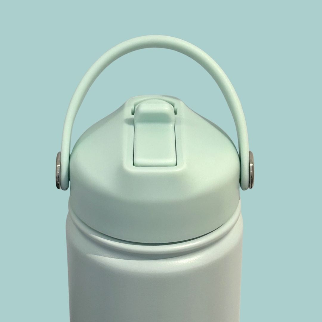 Kids water bottle easy-sip straw lid soft handle up front view on turquoise blue Grip bottle 
