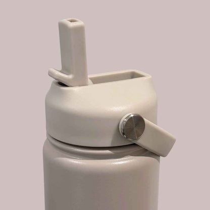 Kids water bottle easy-sip straw lid open with handle on taupe Grip bottle 