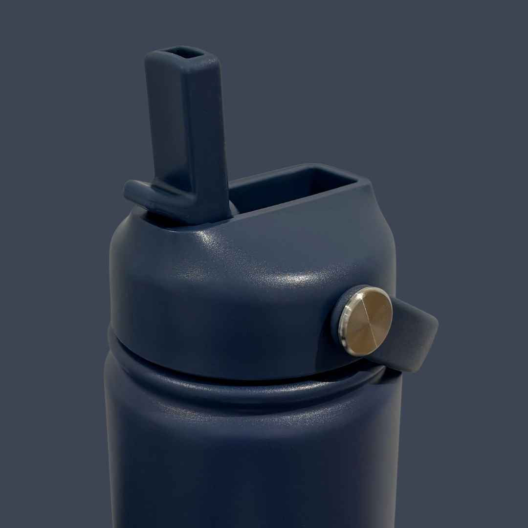 Kids water bottle easy-sip straw lid open with handle on navy blue Grip bottle 
